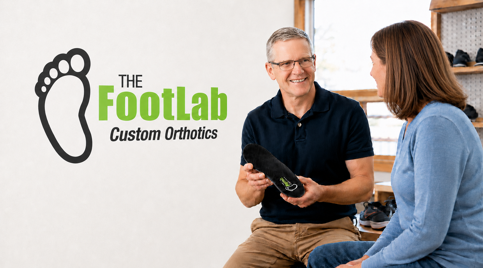 Man-Showing-Woman-Custom-Orthotics | The FootLab Custom Orthotics | St Paul Minneapolis MN Man showing woman custom orthotics